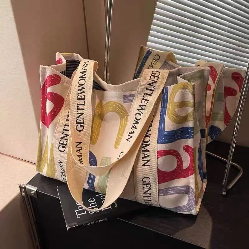 Large canvas women's tote bag with printing, shown in different colour and pattern style options.