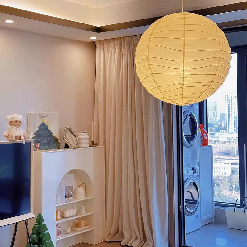 Japanese-style spherical rice paper chandelier pendant light in a living room setting.