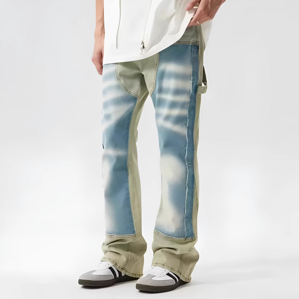 Retro jeans featuring yellow and blue patchwork splash-ink damaged design on non-stretch denim.