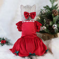 Pet Christmas dress in red silver fox velvet with matching headdress flower on a small dog