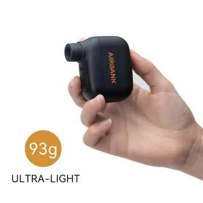 Black AS100 mini electric bike pump with USB charging cable and waterproof bag.
