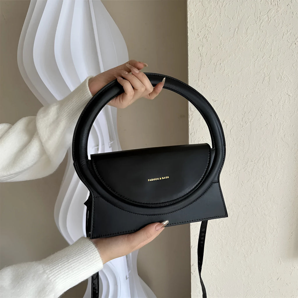 PU messenger bag in a horizontal square shape with a sandwich pocket and stitching detail.