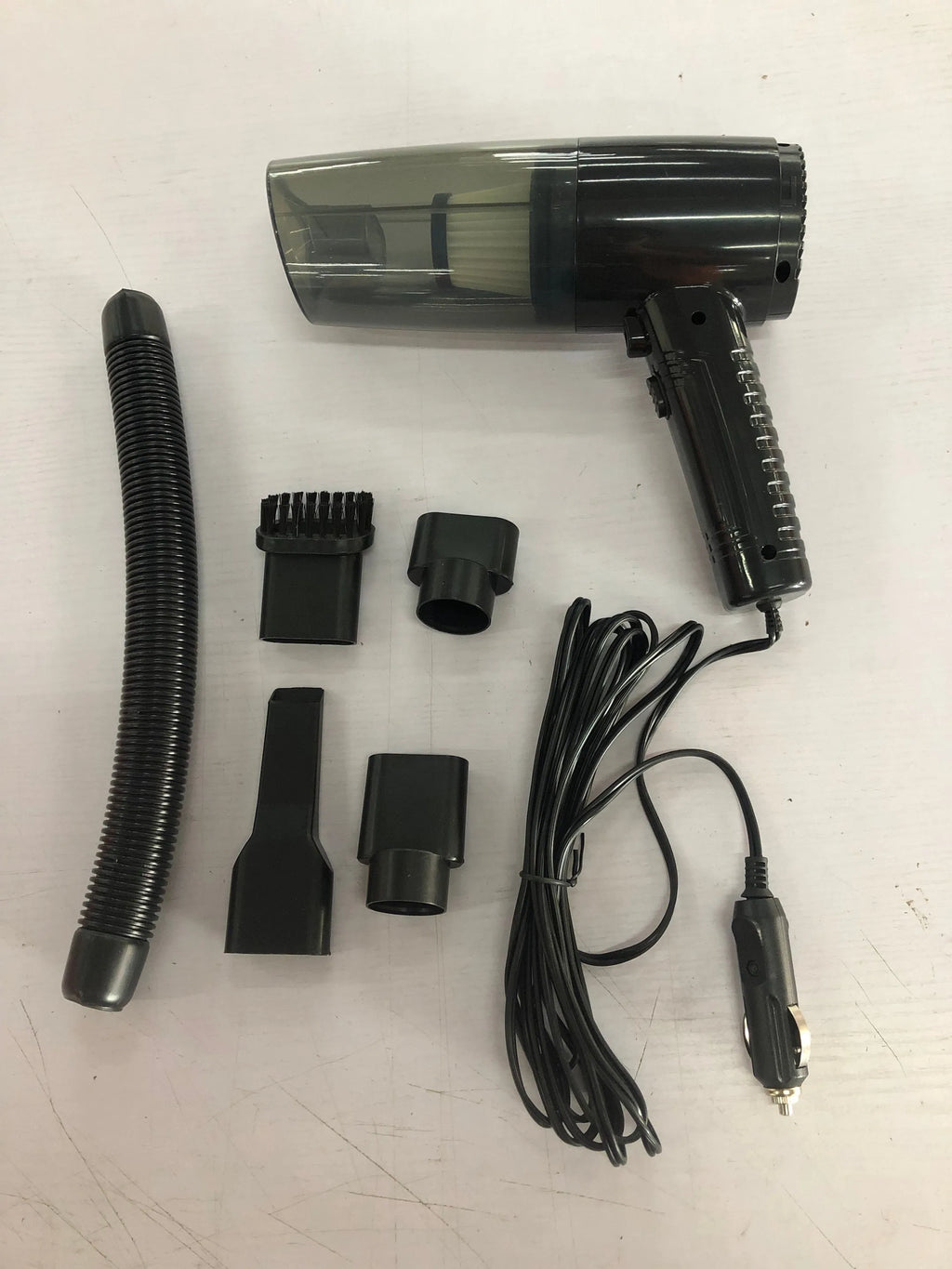 12V car vacuum cleaner with accessories in starry sky black colour showing suction power demonstration
