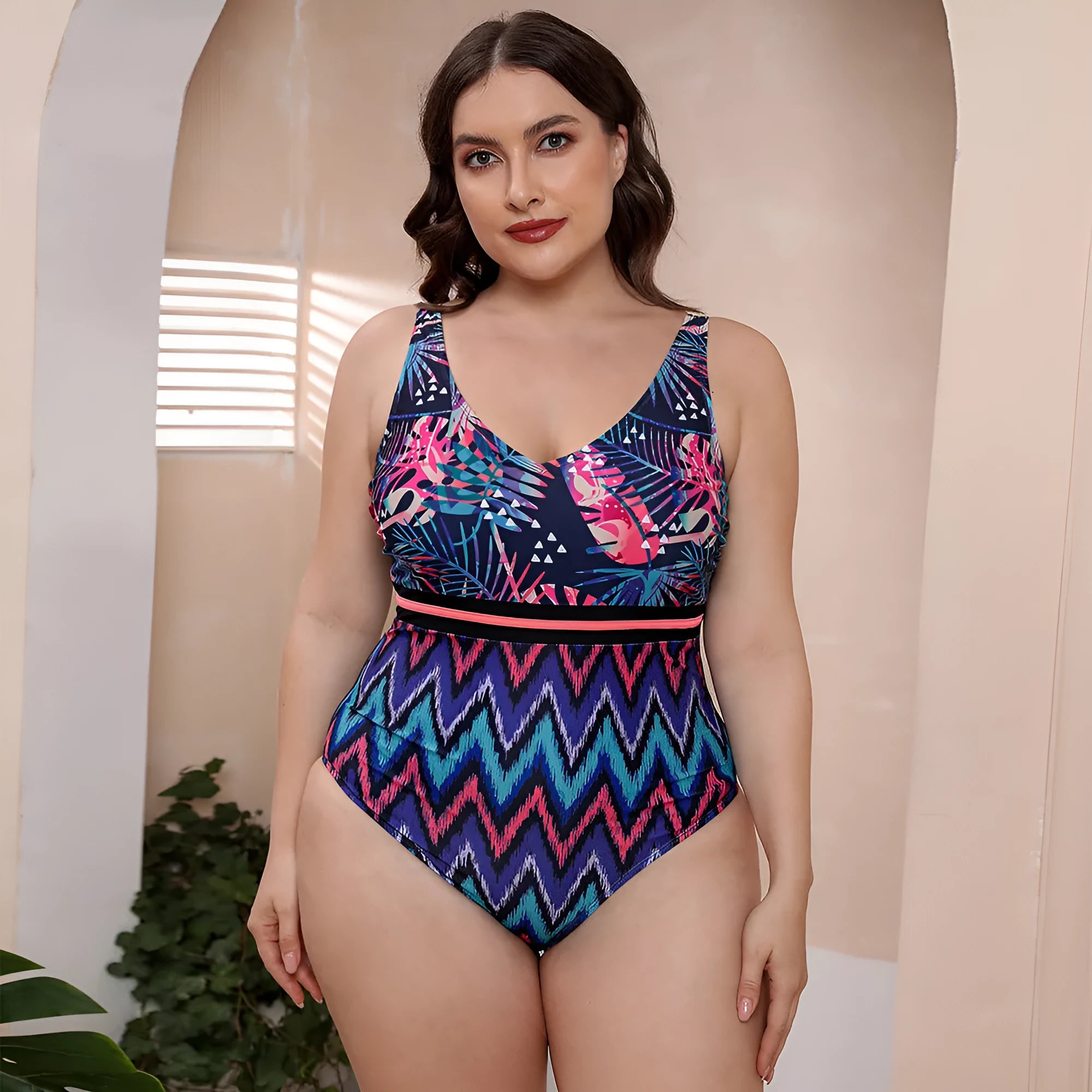Blue printed stripe women's one-piece swimsuit with spaghetti straps on a mannequin.