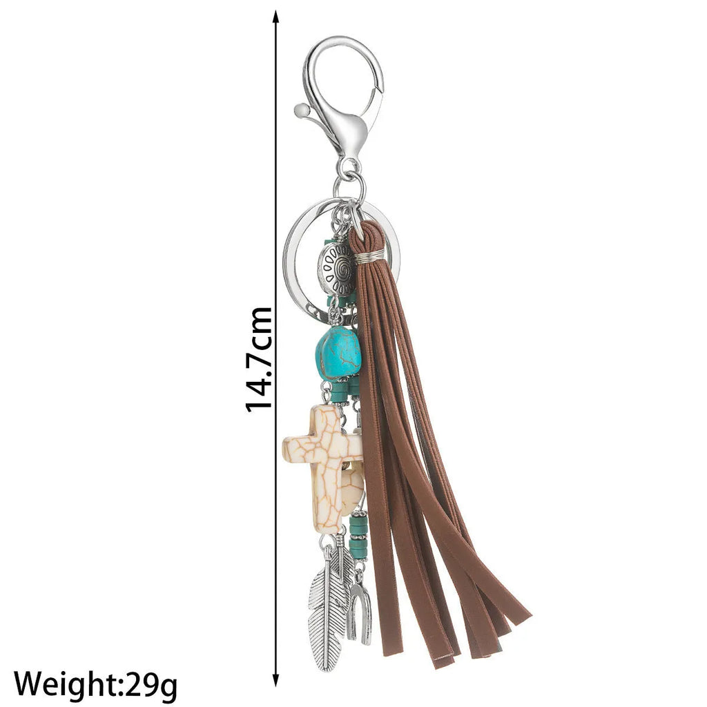 Cross alloy leather tassel pendant keychain in retro style, colour XY-3669, on a neutral background