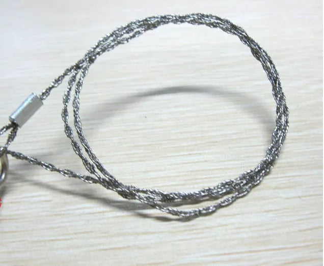 Stainless steel wire survival saw with thumb rings coiled for outdoor camping