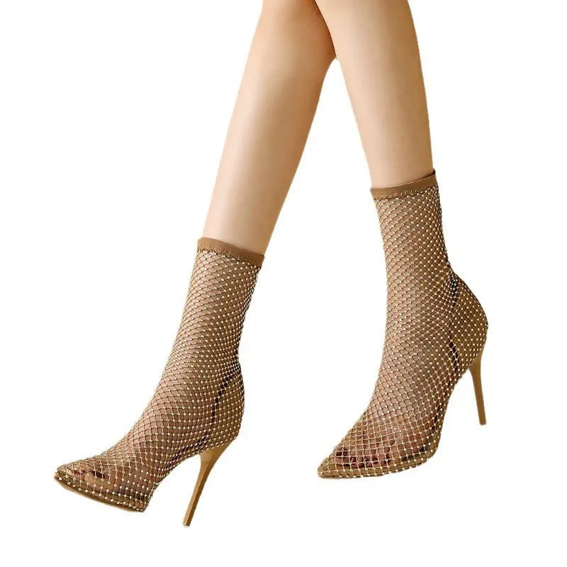 Gold women's pointed toe stiletto high heel sandals with mesh upper and oversleeves.