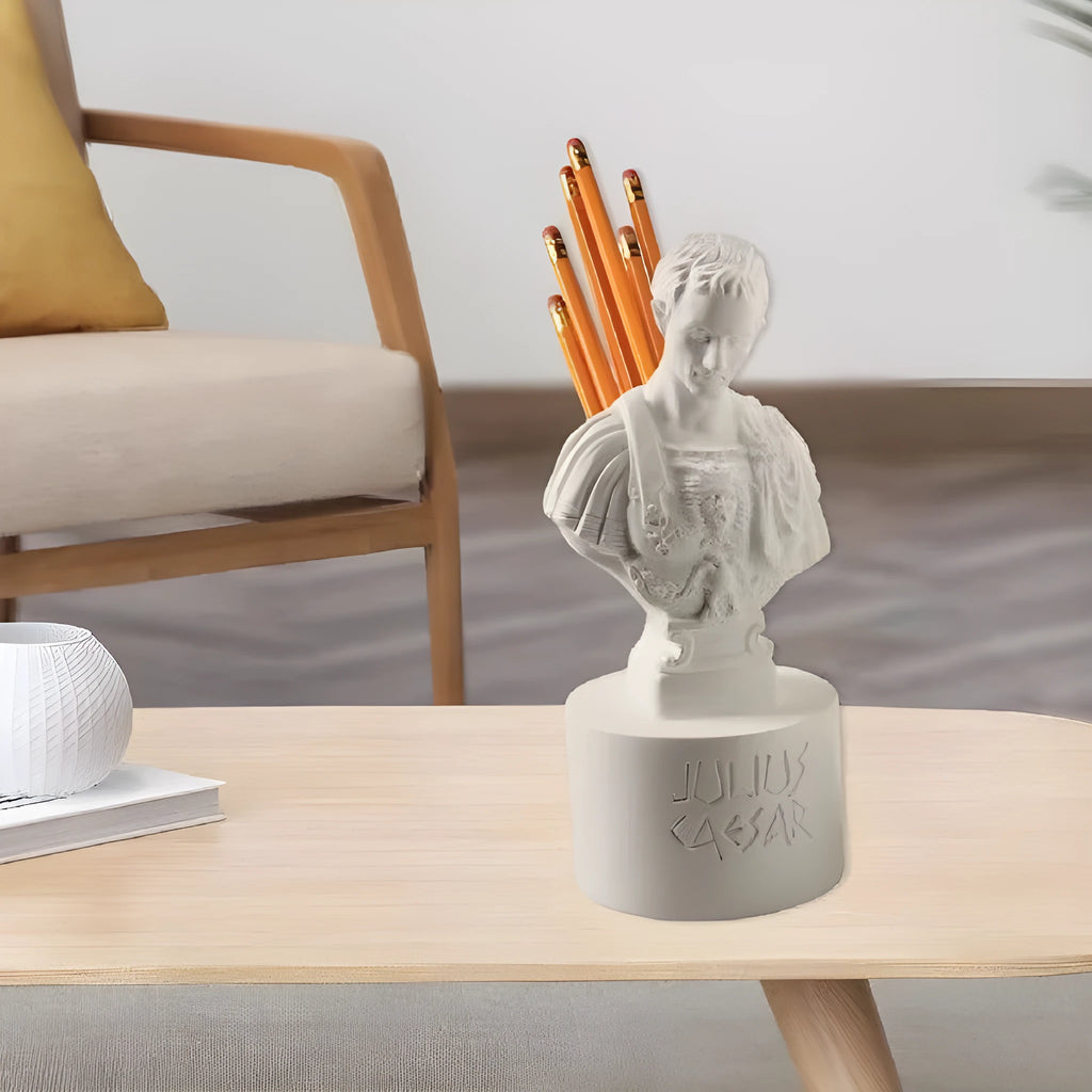 White synthetic resin character model pen holder on a desk.