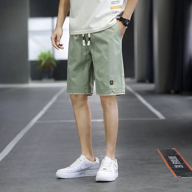 Men's straight loose-fit casual shorts in green with an elastic waistband, Korean style.
