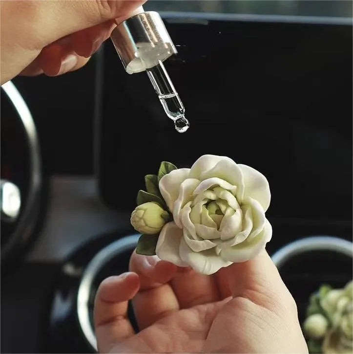 Jasmine scent solid gypsum car air vent clip diffuser measuring 5 by 4.5 centimetres.