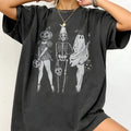 Loose fit cotton t-shirt in black with round neck and short sleeves on a hanger