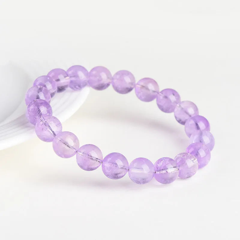 Lavender amethyst crystal bracelet with geometric round beads showing water ripple pattern