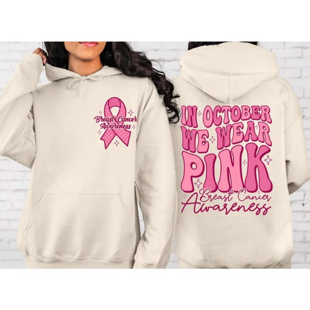 Women's pink breast cancer awareness pullover hoodie with a retro graphic design and side seam pockets.