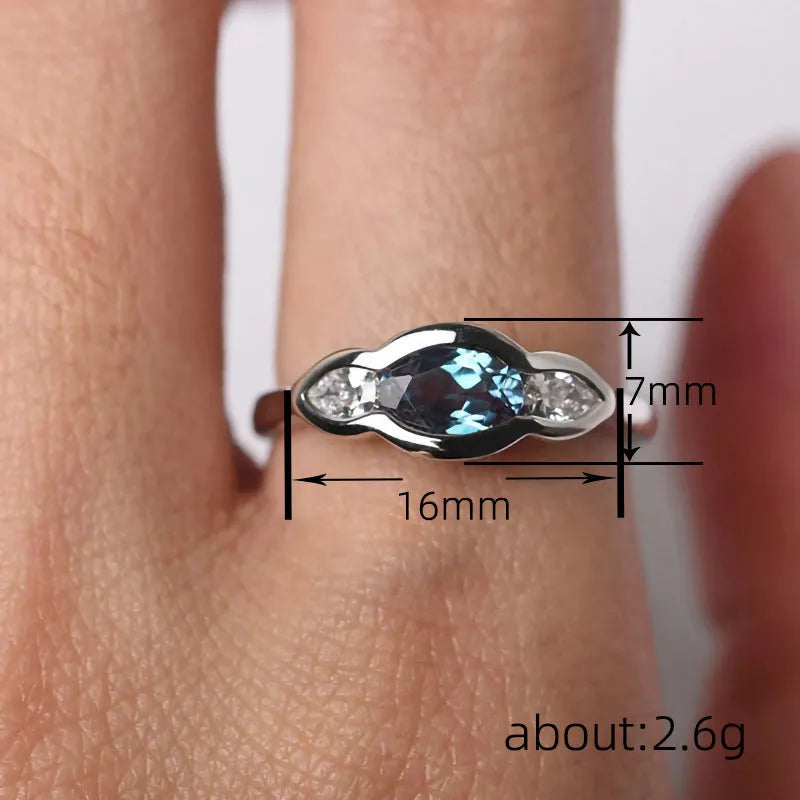 Geometric ellipse women's ring with zircon inlay in white gold colour plating