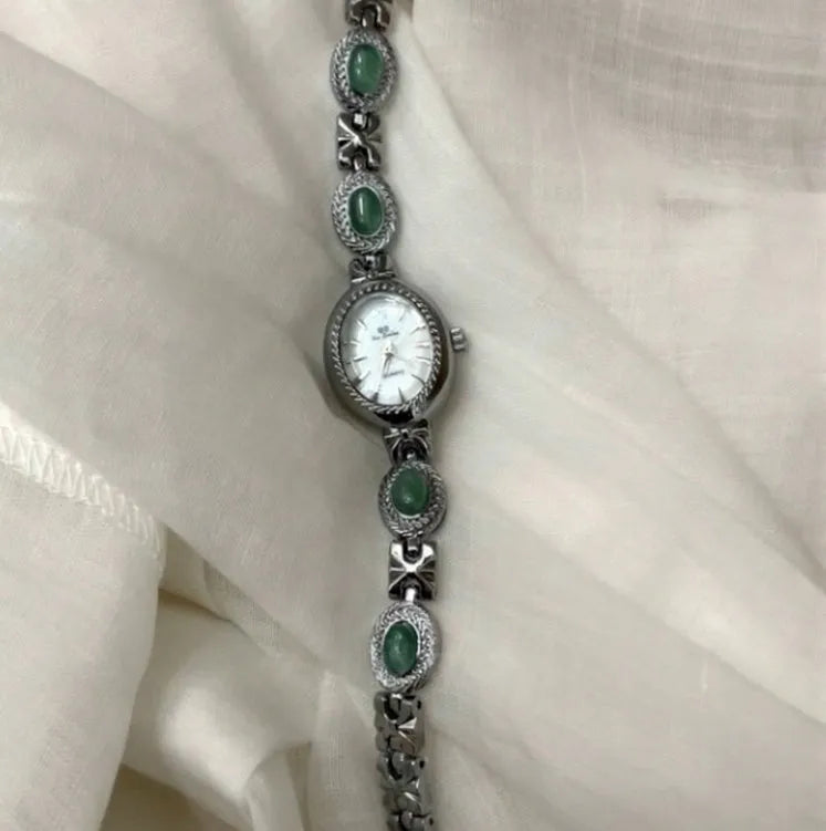 Green jade ladies quartz watch with silver case and white face