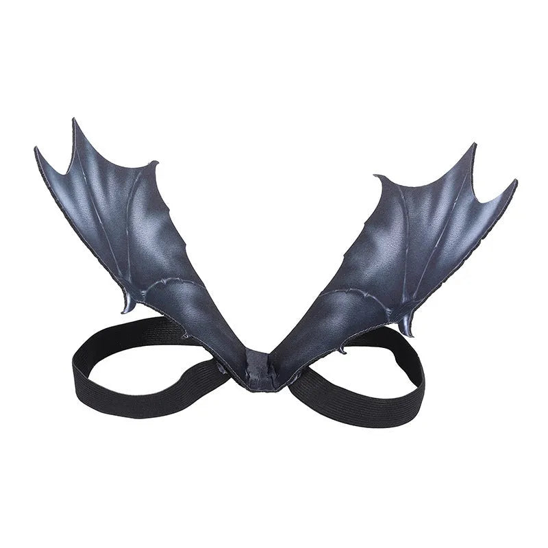 Black cloth bat wing costume for a cat or dog, showing large wing span.