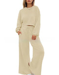 Women's solid colour casual trouser set with long sleeves in pink, showing top and trousers laid flat.