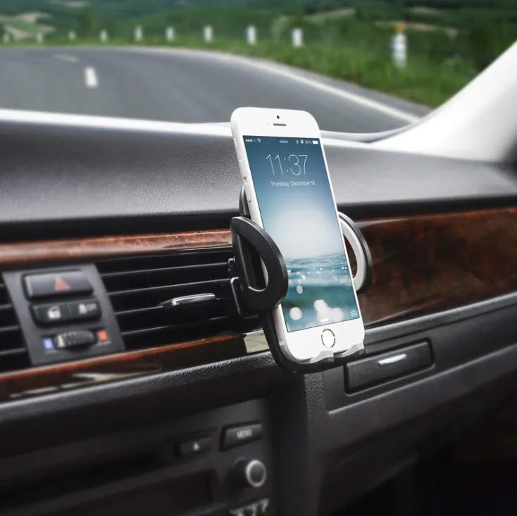 Black car mobile phone holder mounted on air conditioning vent with adjustable clamp for smartphones