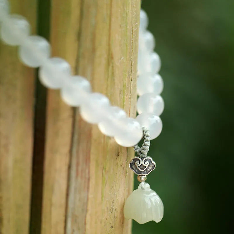 Women's S925 silver bracelet with white agate and Hetian jade stones in geometric lotus design