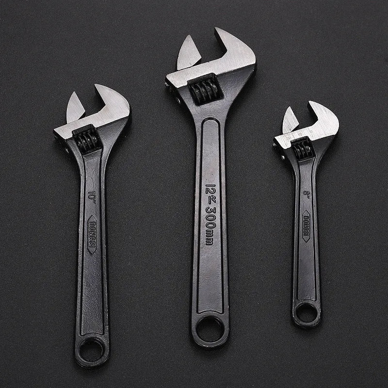 High carbon steel open-end adjustable wrench with black finish on a grey background.