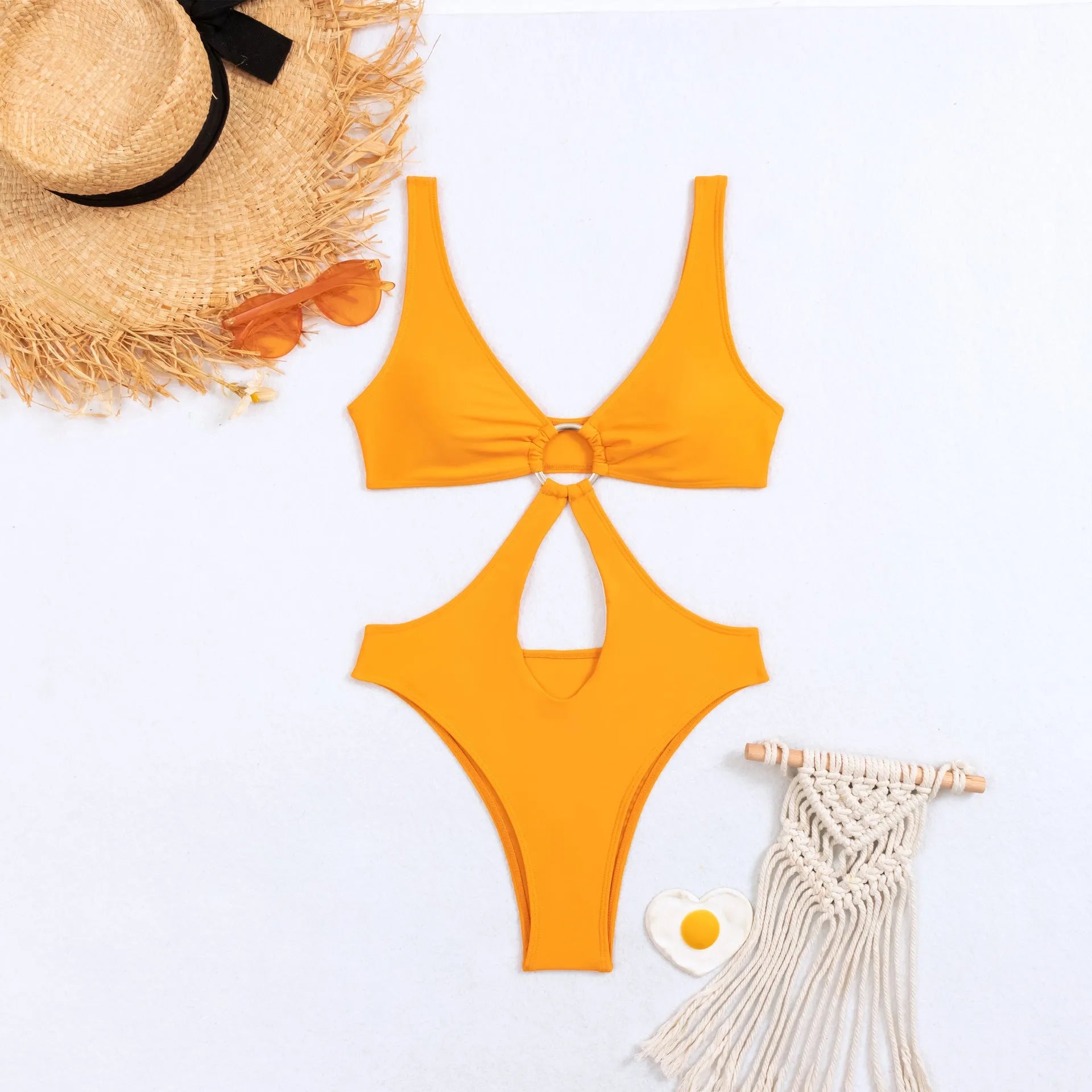 Women's black triangle one-piece swimsuit on a hanger, sleeveless design.