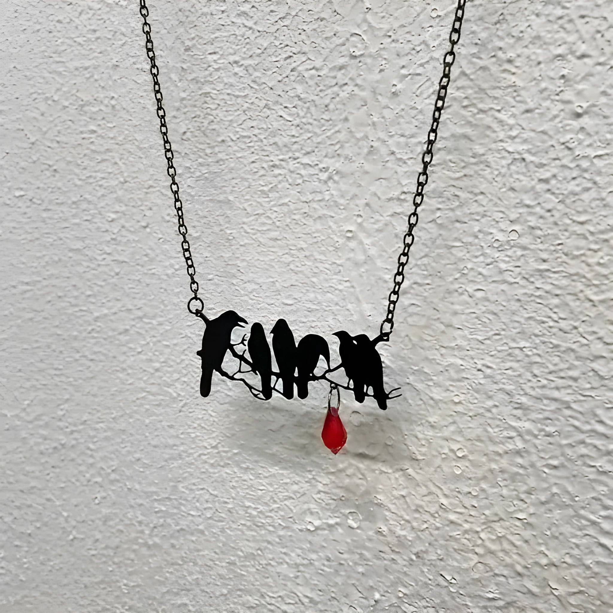 Black electroplated alloy crow pendant necklace with cross chain design