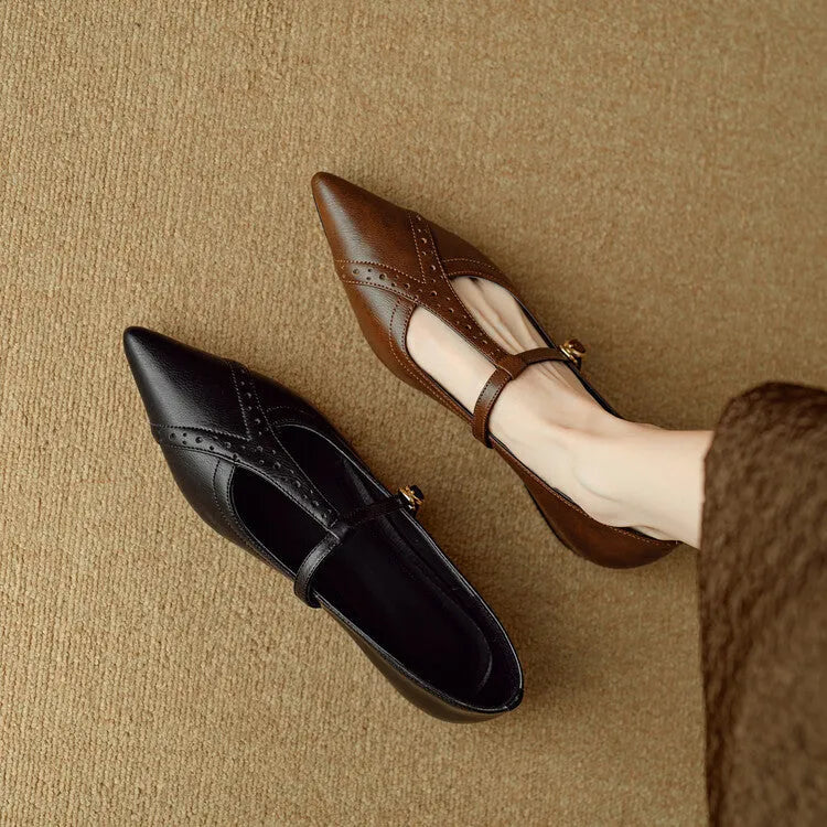 Brown women's cowhide leather flat shoes with round toe and metal detail on a soft sole.