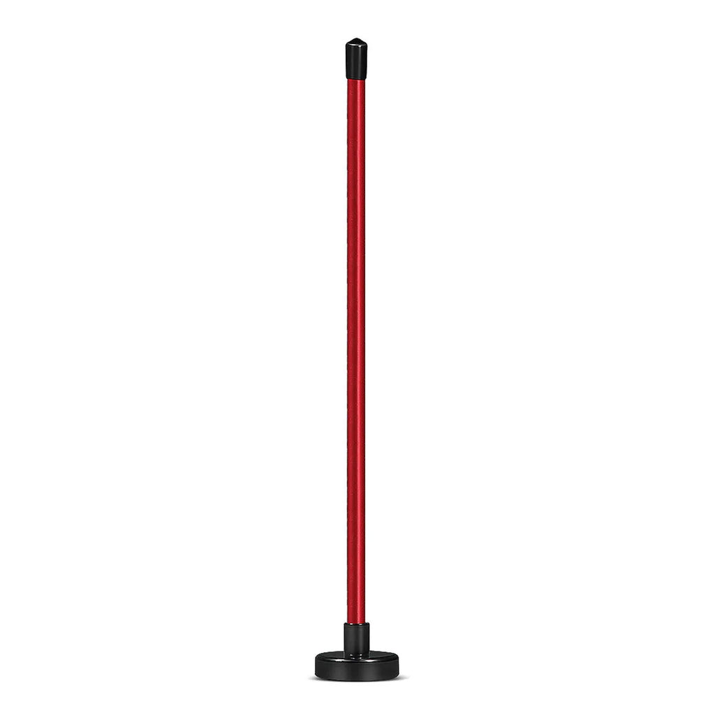 Red and blue aluminium alloy golf swing alignment trainer on a practice mat.