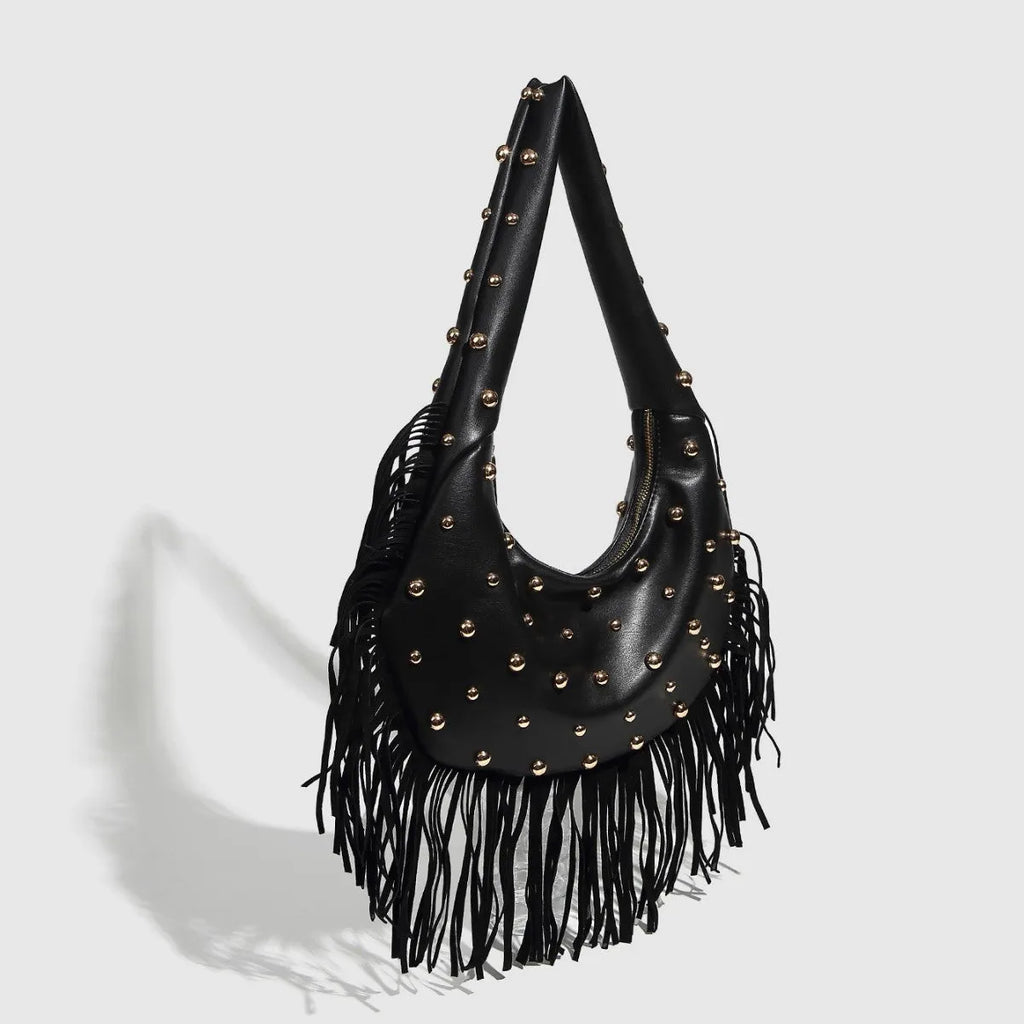 Retro black shoulder handbag with long tassel fringe and internal mobile phone compartment.