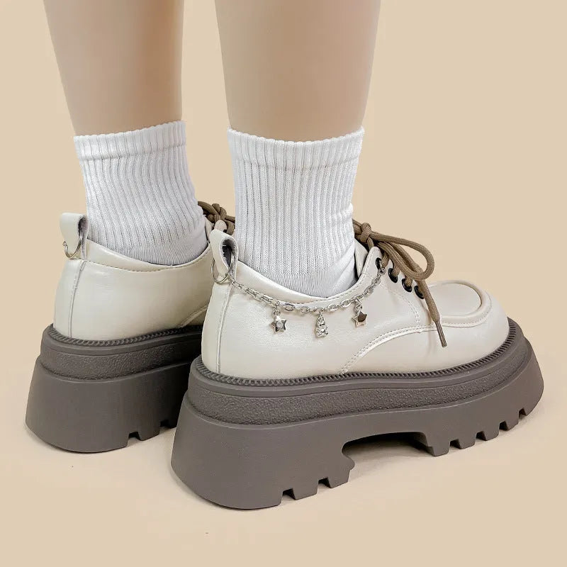 White women's platform Mary Jane shoes with round toe, chunky heel, and front lace-up in British college style.