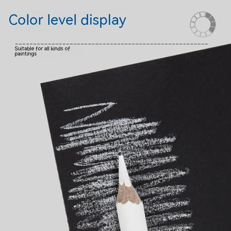 Set of three white charcoal pencils in wooden barrels for artistic highlighting