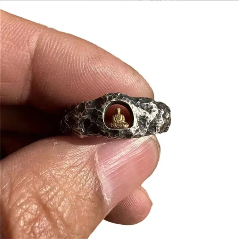 Hand-forged copper Grotto Buddha ring with rock texture on a size 8 band.