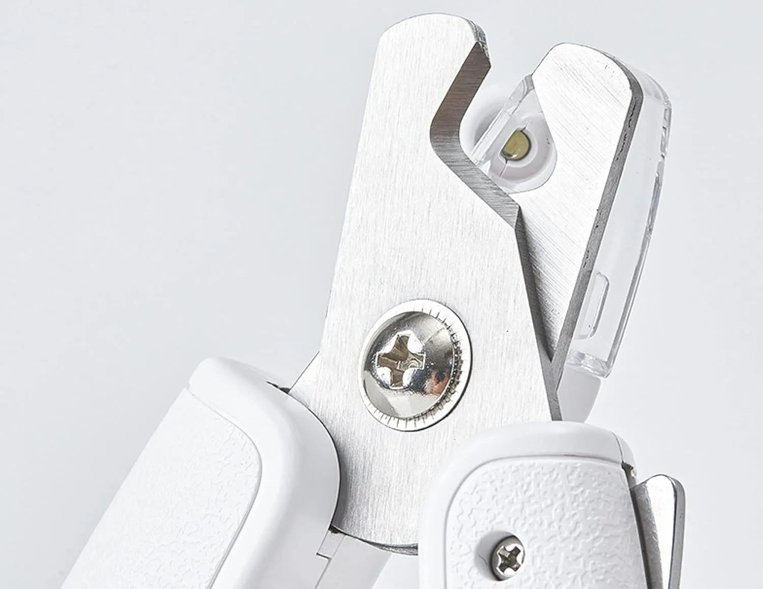 White pet nail clippers with built-in LED light and transparent anti-splash guard.