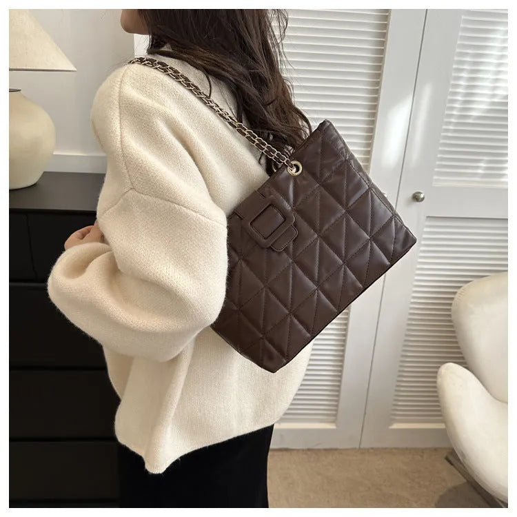 Women shoulder bag in trapezoid shape with chain strap, PU material, three-dimensional pocket, available in black white khaki brown