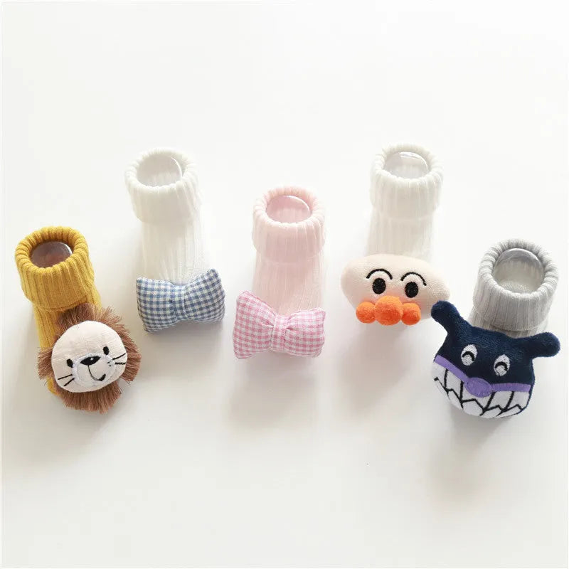 Cotton baby floor socks in various colours and patterns including bows, stars, and animal designs