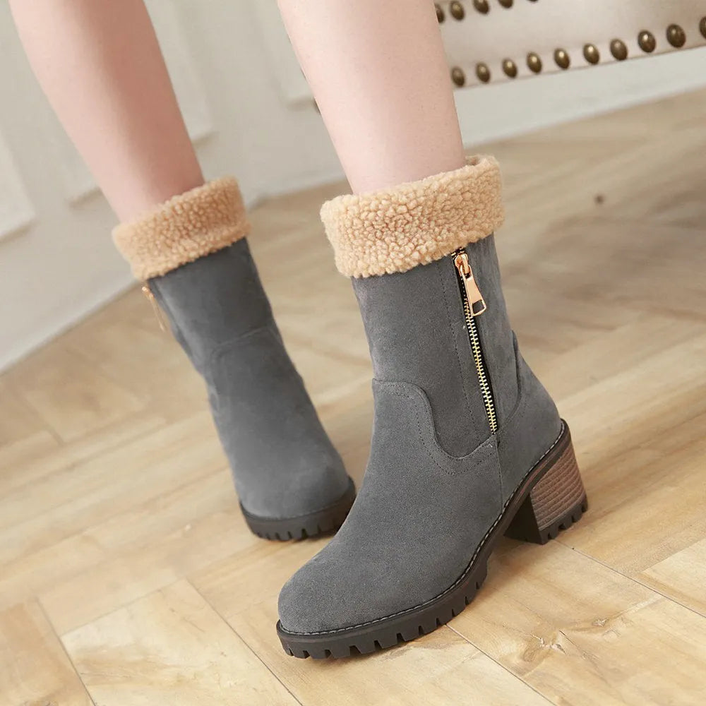 Snow boots with rubber sole and plush lining in black, grey, green, or orange colour options.