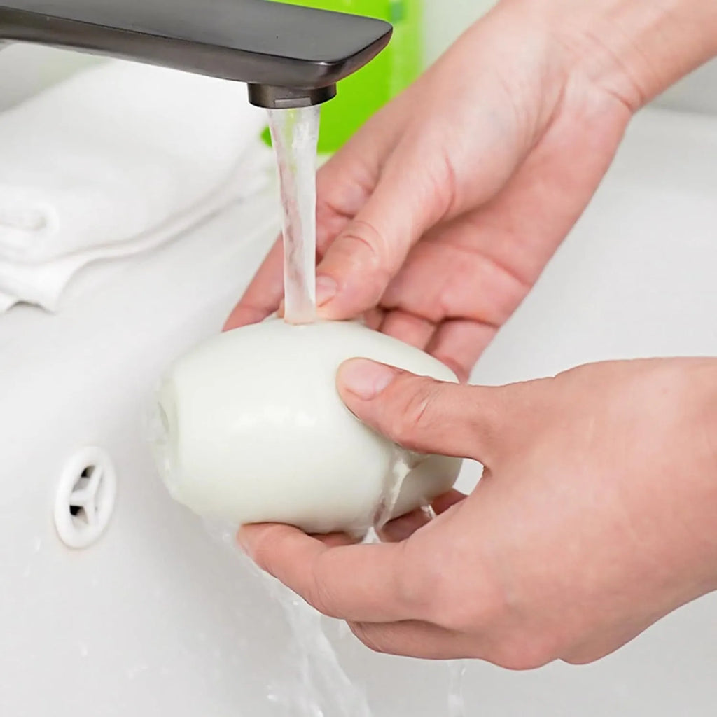Green and white washable reusable gel lint roller ball for portable pet hair removal