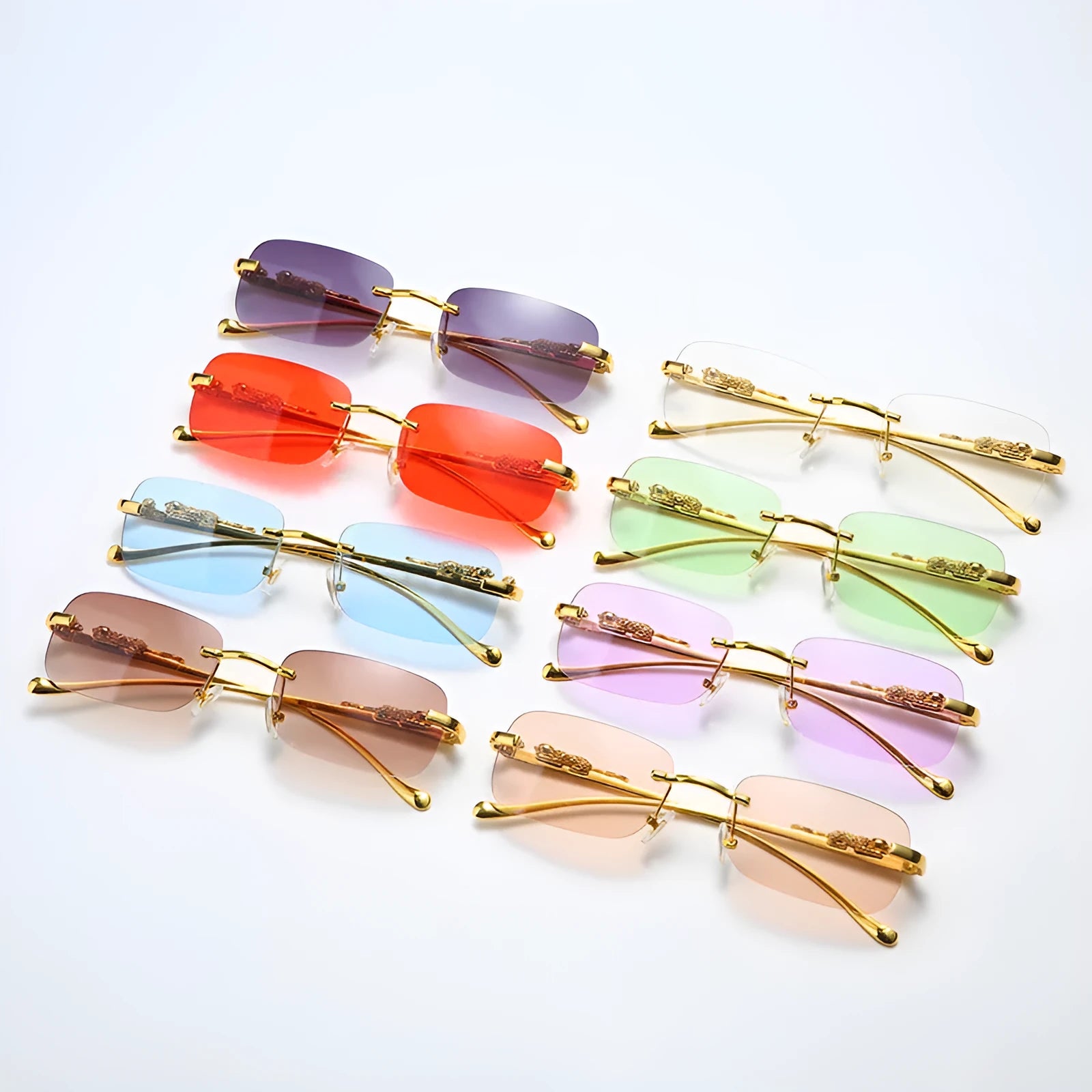 Gold metal leopard head frameless square sunglasses with pink PC lenses on a white background