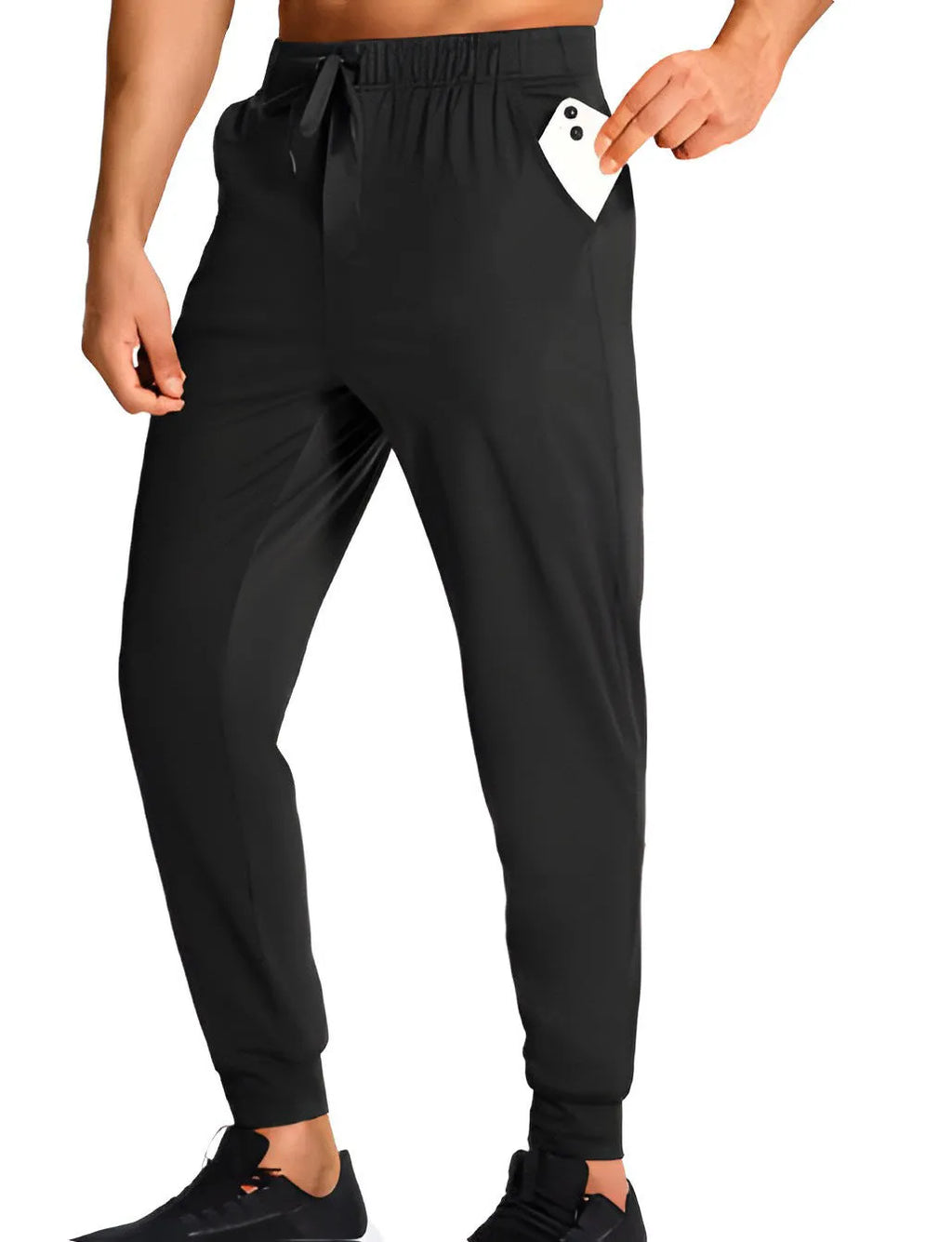 Man wearing loose-fit solid colour casual polyester trousers in a leisure setting.