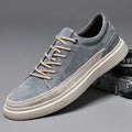 Men's grey casual skate shoes with pigskin leather upper and rubber sole, front lace-up closure