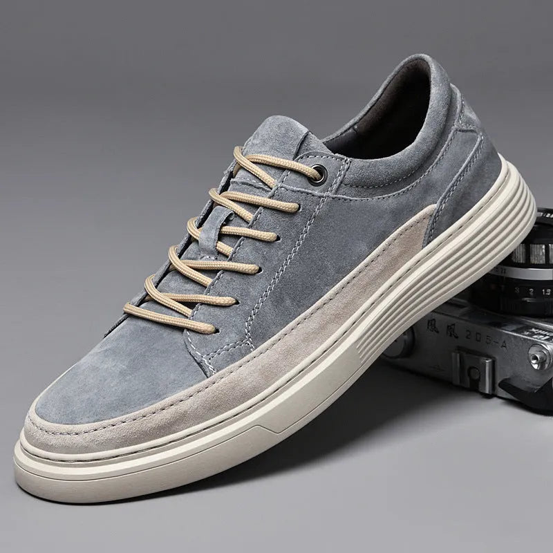 Men's grey casual skate shoes with pigskin leather upper and rubber sole, front lace-up closure