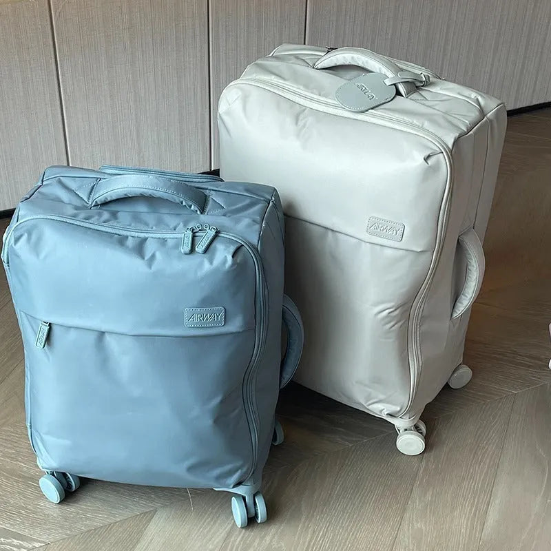 Ultra-light waterproof Oxford cloth suitcase in bluestone green with universal wheels