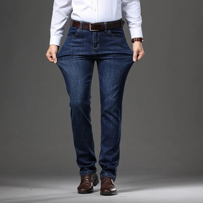 Women's straight-leg stretch jeans in mid-waist style with zip fly, available in black and blue