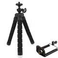 Black flexible octopus tripod with bendable legs wrapped around a pole, holding a smartphone.