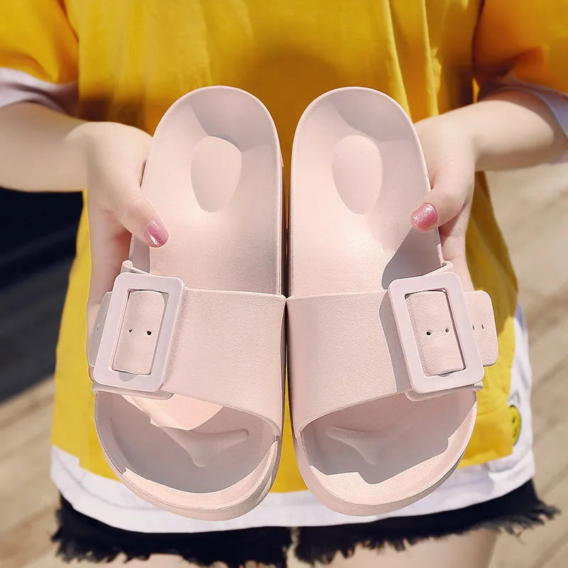 Women's grey blue flip-flop sandals with an adjustable buckle on the strap and a soft EVA sole.