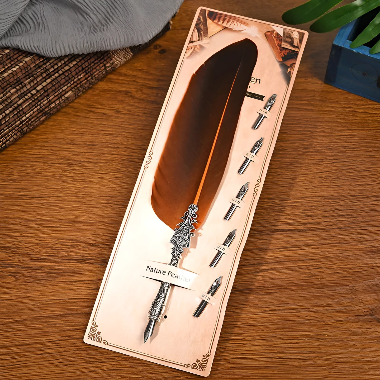 Vintage feather dip pen with zinc alloy body in ten colour options on cardboard packaging.