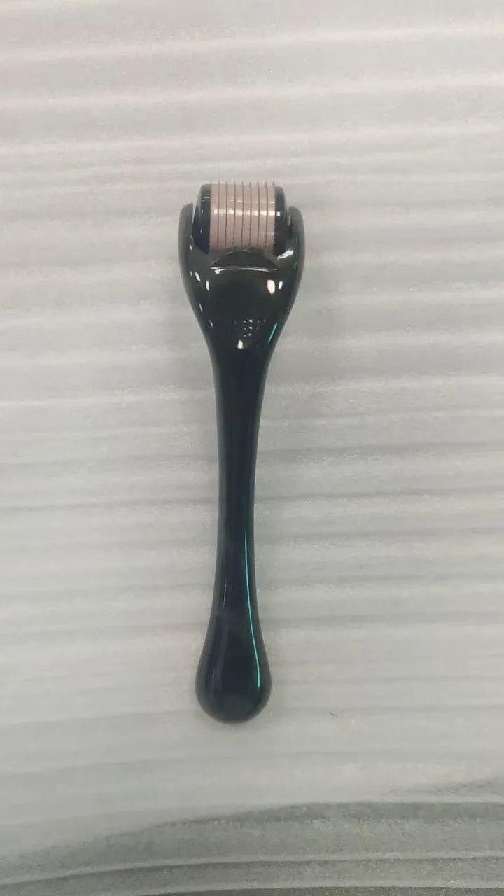 Black handle microneedle roller with purple wheel showing 540 needles, next to white and blue handle options.