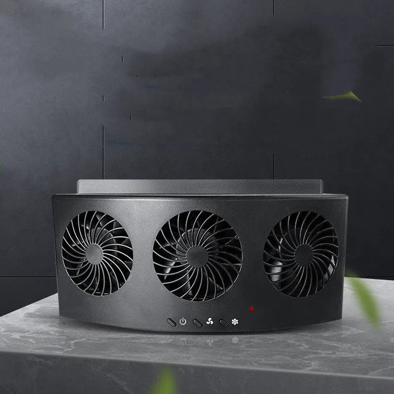 Black and white USB-powered car ventilation fan for exhaust odour removal on a car dashboard.