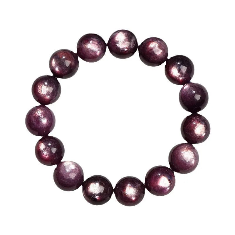 Purple lepidolite crystal bracelet showing polished round beads on adjustable string in natural lighting