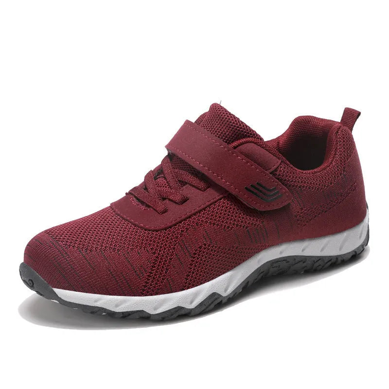 Women's grey purple low-top wedge heel shoes with mesh upper and Velcro strap fastening.